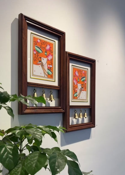 Kamdhenu Krupa | Hand-Painted Pichwai Teak Wood Wall Frame with Brass Bells – Saffron